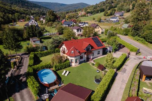an aerial view of a house with a red roof at Pokoje Marta in Międzybrodzie Bialskie