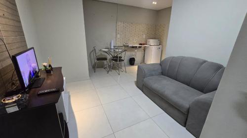 a living room with a couch and a table at Flats 1778 N102 Orla de PETROLINA in Petrolina