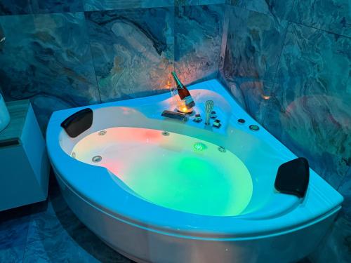 a bathroom with a bath tub with a sink at Lodevì in Foggia