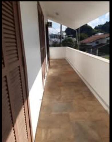 an empty balcony with a view of a room at Hostel da Dani in Balneário Camboriú