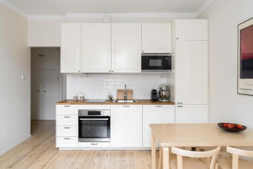 Kuchyň nebo kuchyňský kout v ubytování Apartment in Kamppi