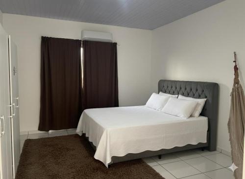 Postel nebo postele na pokoji v ubytování Hotel Gomes