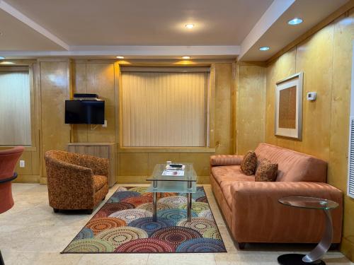 a living room with a couch and a table at The Eldon Luxury Suites in Washington, D.C.