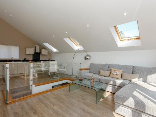 a living room with a couch and a table at Waterside Lodge Thirteen - Uk11853 in Southowram