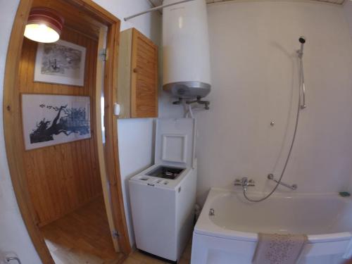 a bathroom with a sink and a washing machine at A nice view, panorama over Lago Maggiore in Ronco sopra Ascona