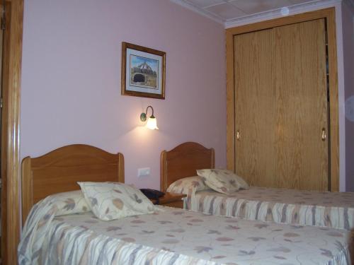 Hotel Mesón el Castilloにあるベッド