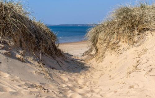 a pair of sand dunes on the beach at 4 Bedroom Beautiful Home In Heberg in Grimsholmen
