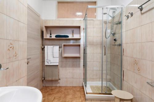 a bathroom with a shower and a sink at Appartamento Spormaggiore in Spormaggiore