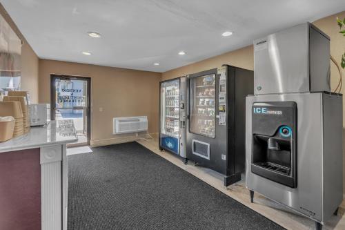 a kitchen with an ice machine in a store at Bentley Motel in Linden