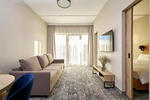 Μια τηλεόραση ή/και κέντρο ψυχαγωγίας στο Złoty Horyzont Lux Główny Budynek z basenem, siłownią, grotą solną, bawialnią i restauracją Horyzont Smaków