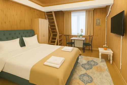 a bedroom with a bed and a living room at Airport 179A in Otopeni