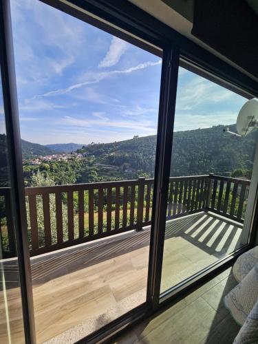 a view from a window of a balcony at Casa dos Pobres in Castro Daire