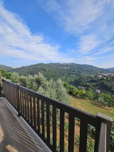 a balcony with a view of a mountain at Casa dos Pobres in Castro Daire