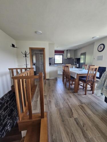 a dining room and kitchen with a table and chairs at Casa dos Pobres in Castro Daire