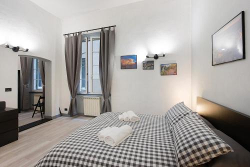 a bedroom with a bed with two pillows on it at Cuore di Genova in Genova