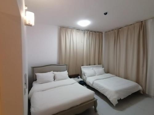 Voodi või voodid majutusasutuse Full Apartment CBD 2 toas