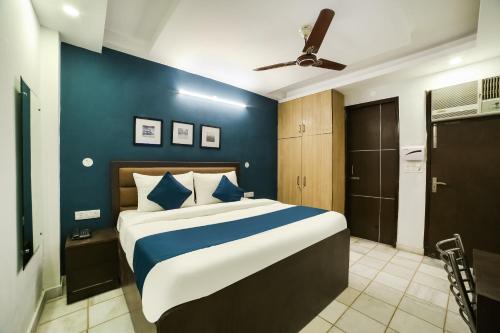 Ένα ή περισσότερα κρεβάτια σε δωμάτιο στο Hotel O Royal Discovery