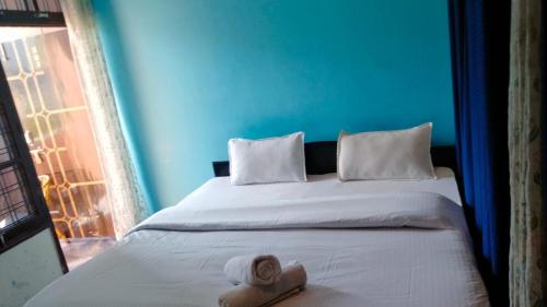 Postel nebo postele na pokoji v ubytování The Ajna Resident Rishikesh