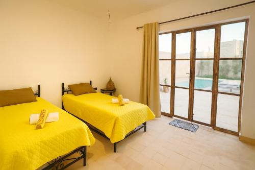 Un ou plusieurs lits dans un hébergement de l'établissement Villa Zina