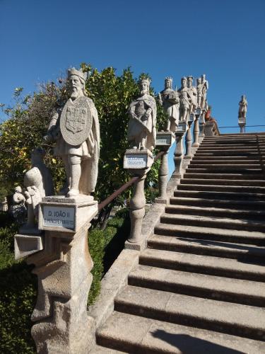 a group of statues on the side of a set of stairs at CiTY CENTER in Castelo Branco