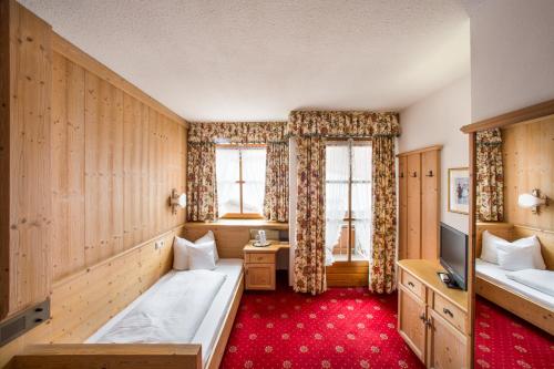 Postel nebo postele na pokoji v ubytování Hotel Hölzer Bräu by Lehmann Hotels