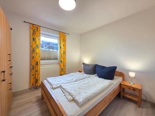 Ένα ή περισσότερα κρεβάτια σε δωμάτιο στο Komfortferienhaus Deichzauber Norddeich