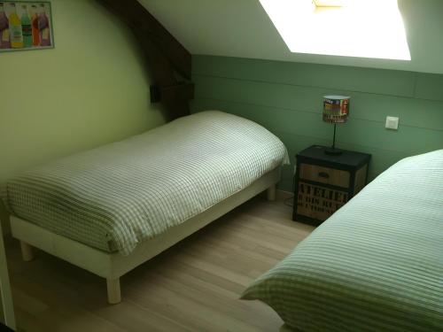 Katil atau katil-katil dalam bilik di La Cense De La Mérelie - Le Fournil