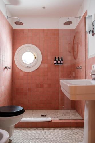 a bathroom with a toilet and a sink at Il Capri Hotel in Capri