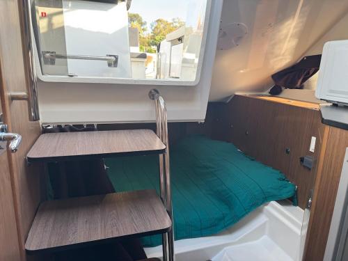 a small room with two chairs and a mirror at Le Rafifou Porquerolles in Hyères