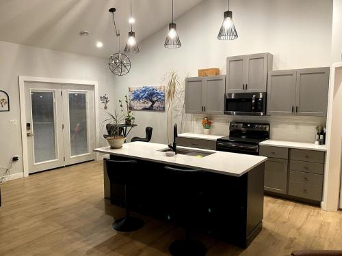 a kitchen with a island in the middle of it at Newly built home in Superior Duluth area in Superior