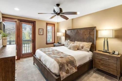 a bedroom with a large bed and a ceiling fan at Ski In, Ski Out 3 Bedroom Condo At The Eagle Bahn Gondola With Slopeside Pool in Vail
