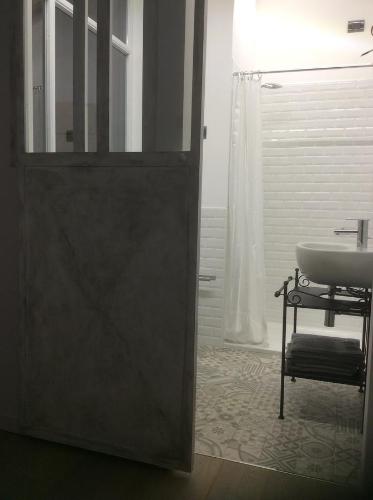 a bathroom with a sink and a mirror at Appartamento73 in Cignone