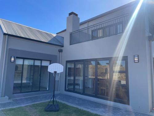 a building with a lamp in front of it at Sunny Side Haven in Faure