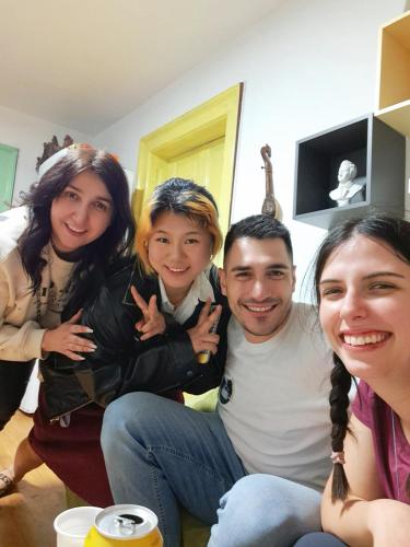 a group of people posing for a picture in a living room at Oneone eleven hostel in Belgrade