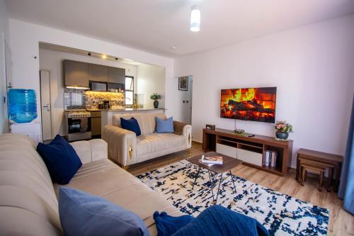 a living room with a couch and a table at BethelHomes in Tatu City