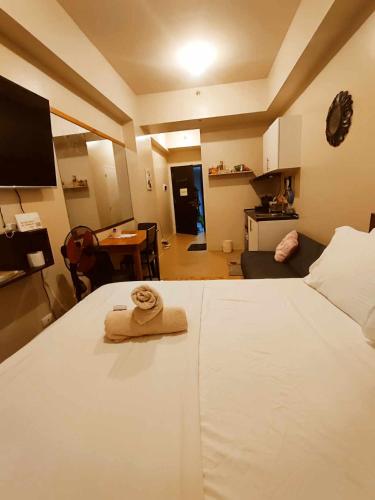 Ένα ή περισσότερα κρεβάτια σε δωμάτιο στο 1218 T4 Atria Comfy Cozy Central