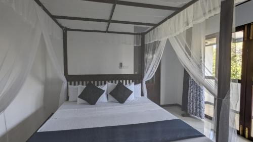 Ένα ή περισσότερα κρεβάτια σε δωμάτιο στο Echo 1 Tangalle