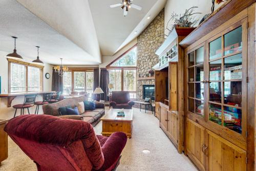 a living room with a couch and a table at Saddlewood Iliff #33 in Breckenridge