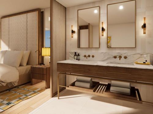 une salle de bain avec un lavabo et un miroir dans l'établissement Sofitel Noosa Pacific Resort, à Noosa Heads