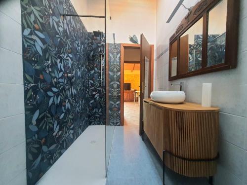 a bathroom with a sink and a mirror at Elena Paternoster in San Lazzaro di Savena