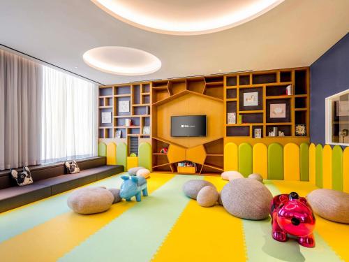 a living room with stuffed animals on the floor at ibis Styles Ambassador Seoul Yongsan in Seoul