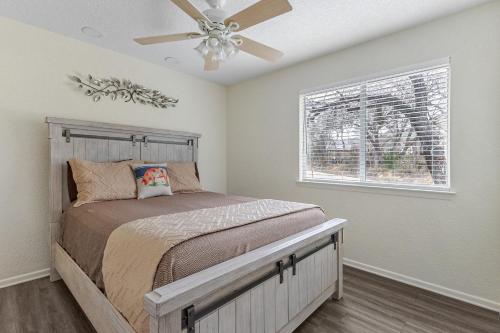 a bedroom with a bed and a ceiling fan at Earth Haus LITE in Fourth Crossing