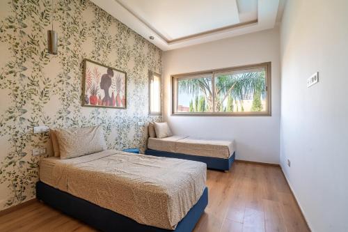 En eller flere senge i et værelse på Zen Villa Private Parking