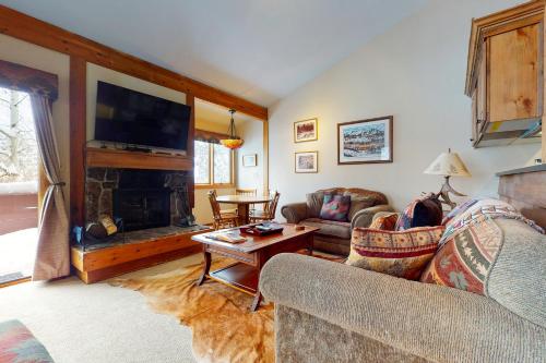 a living room with a couch and a fireplace at 621 Tamarack in Wilson