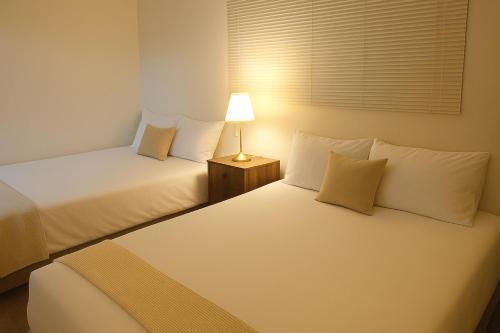 Giường trong phòng chung tại Seoul Station 5min Walk Elevator Free Parking