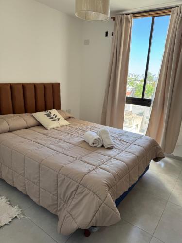 Ένα ή περισσότερα κρεβάτια σε δωμάτιο στο VILLAGE Apart - con cochera