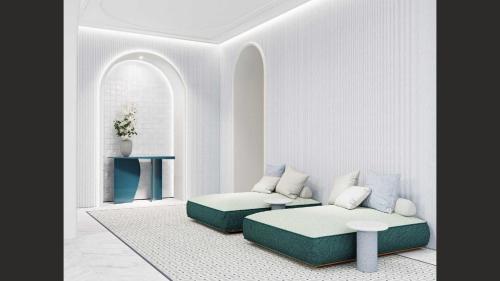 a living room with a couch and a table at Áurea Palacio de la Tinta in Málaga