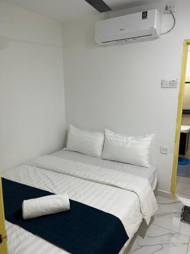 Ένα ή περισσότερα κρεβάτια σε δωμάτιο στο Rest N Go CM