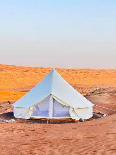 a tent in the middle of the desert at Night Stars Camp in Bidiyah