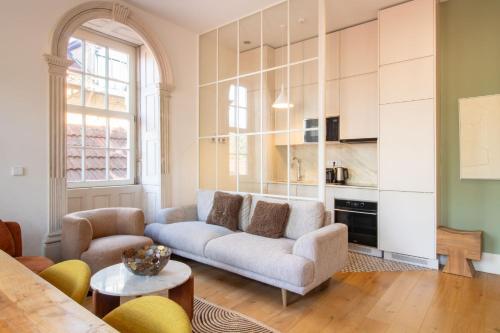 a living room with a couch and a table at Casa Azul Santa Marinha in Vila Nova de Gaia